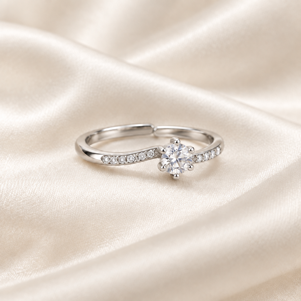 Moissanite ring on ivory satin with overlapping adjustable band